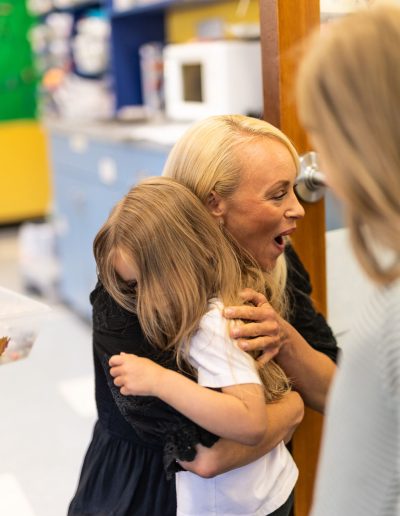 teacher encouraging preschooler