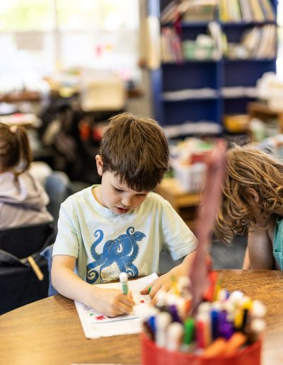 preschool student drawing in art class